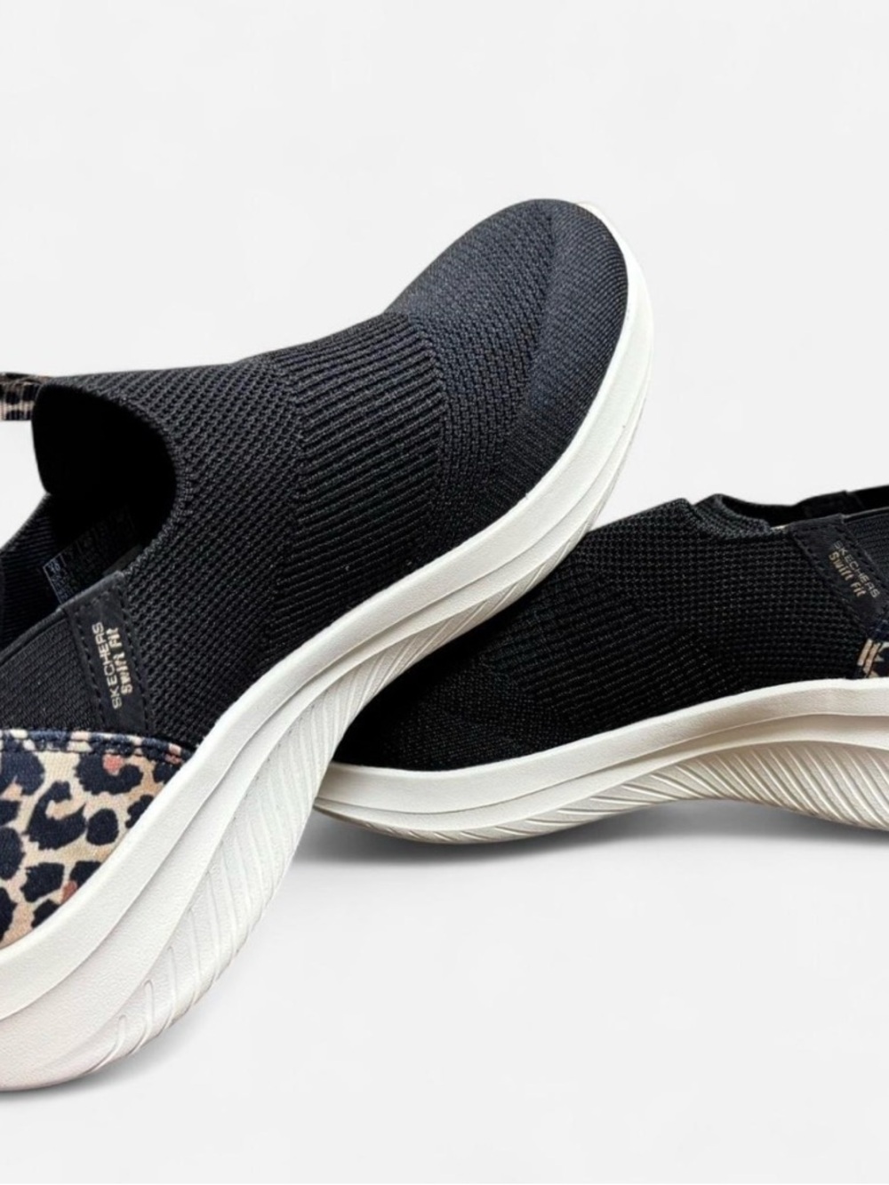 NWOT Skechers Black Slip-On Knit Sneakers with Leopard Accent